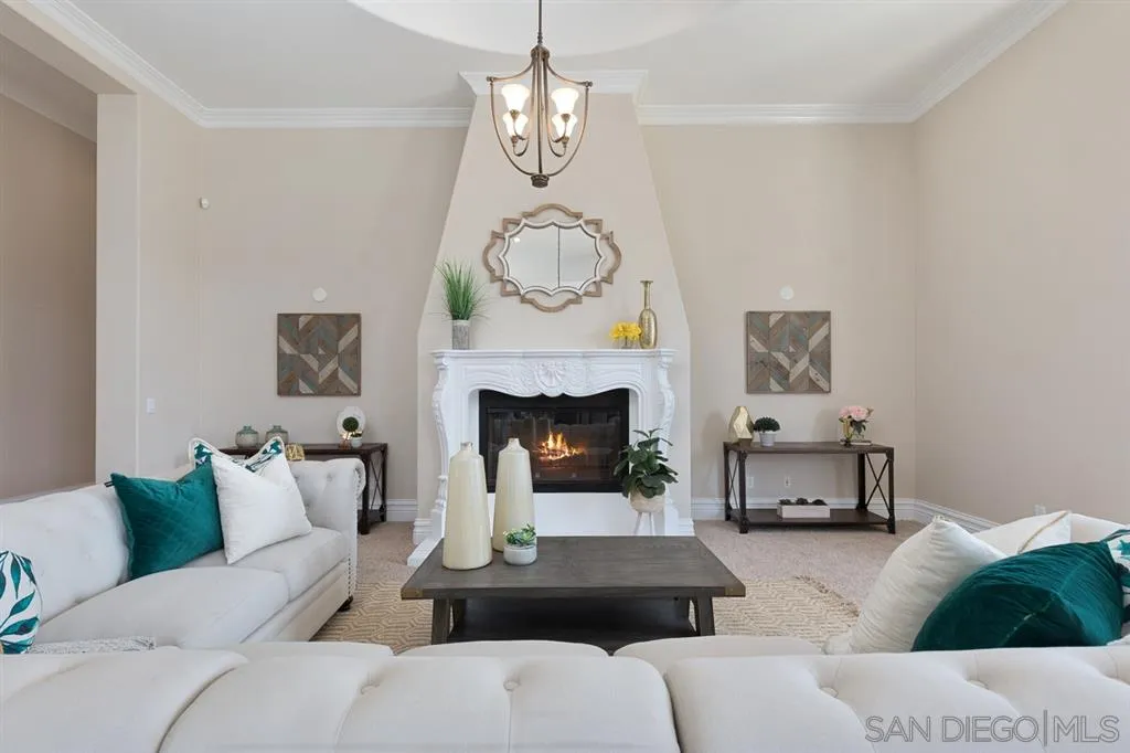 28310 Vía Santa Rosa Temecula, CA 92590 - Photo 7 of 23 a living room with furniture a table and a fireplace