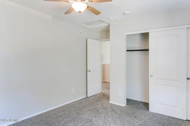 an empty room with a bathroom