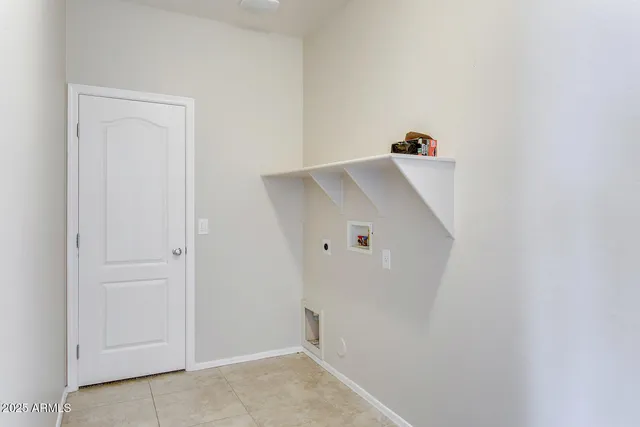 a view of a kitchen with white cabinets