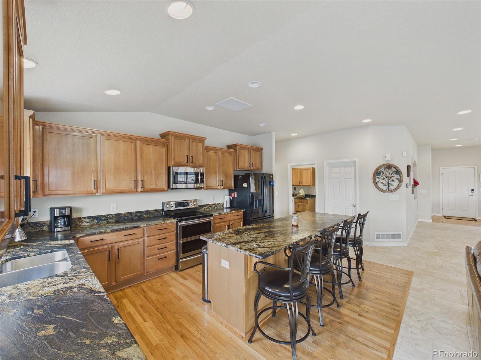 2805 South Jebel Way Aurora, CO 80013 - Photo 20 of 50 a kitchen with a table and chairs in it
