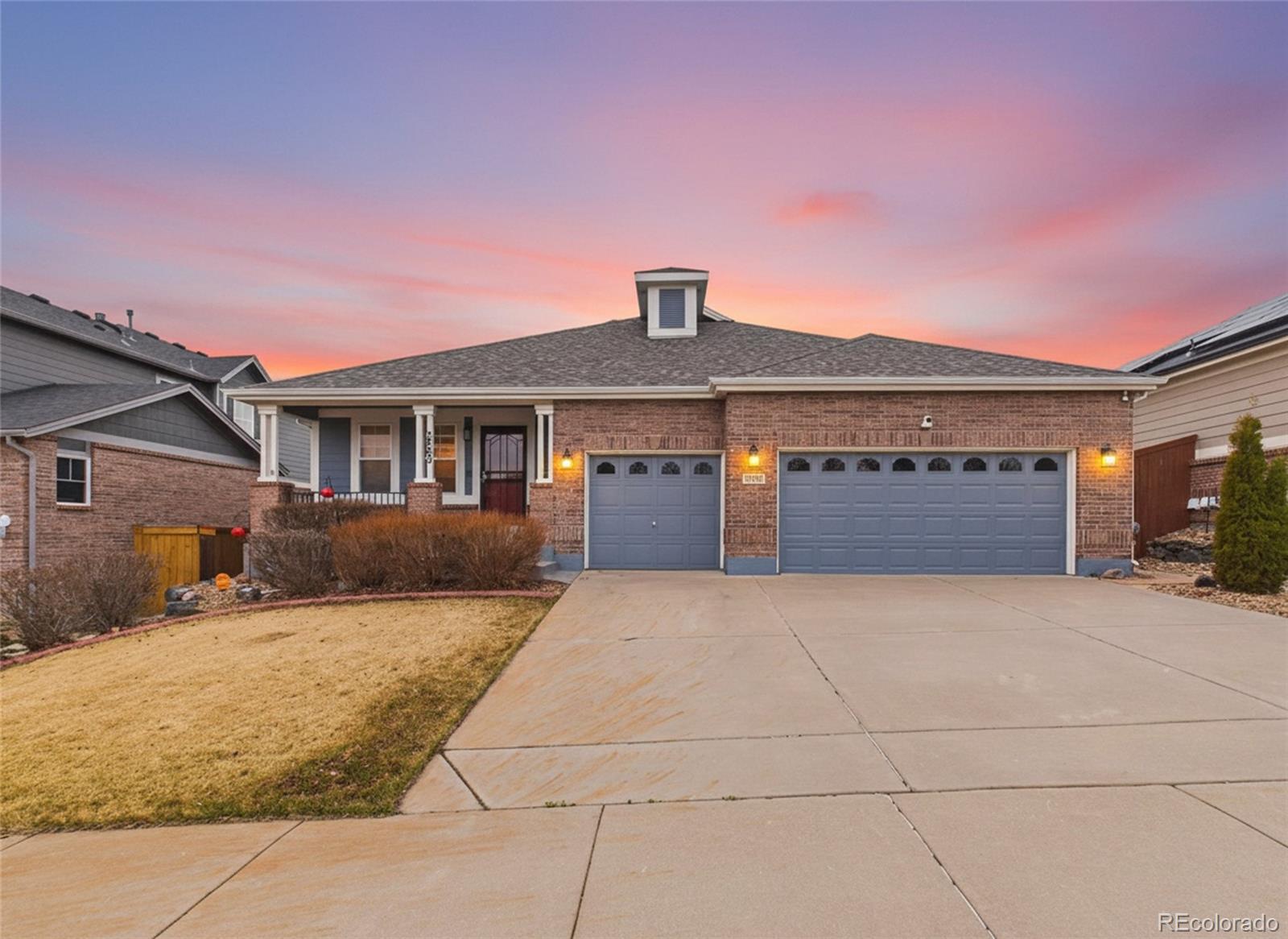 2805 South Jebel Way Aurora, CO 80013 - Photo 2 of 50 a front view of a house with a yard