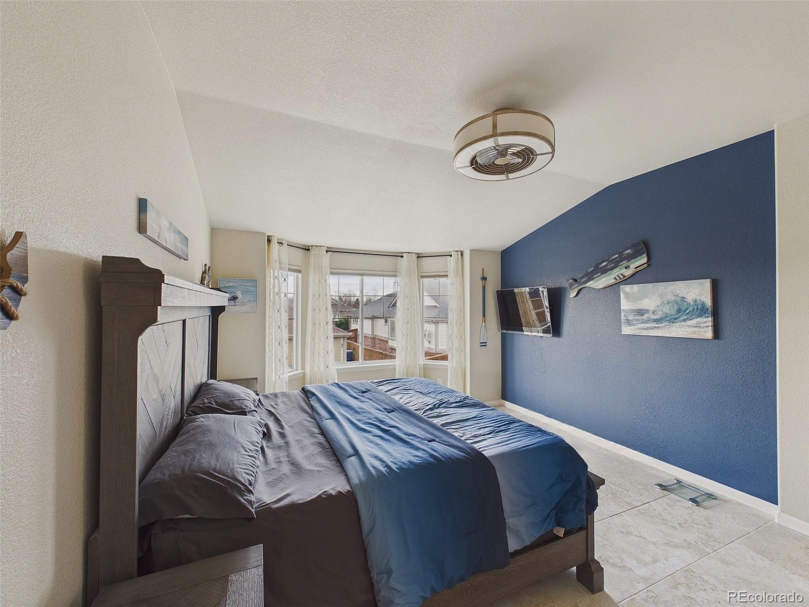 2805 South Jebel Way Aurora, CO 80013 - Photo 28 of 50 a bedroom with a bed and a window