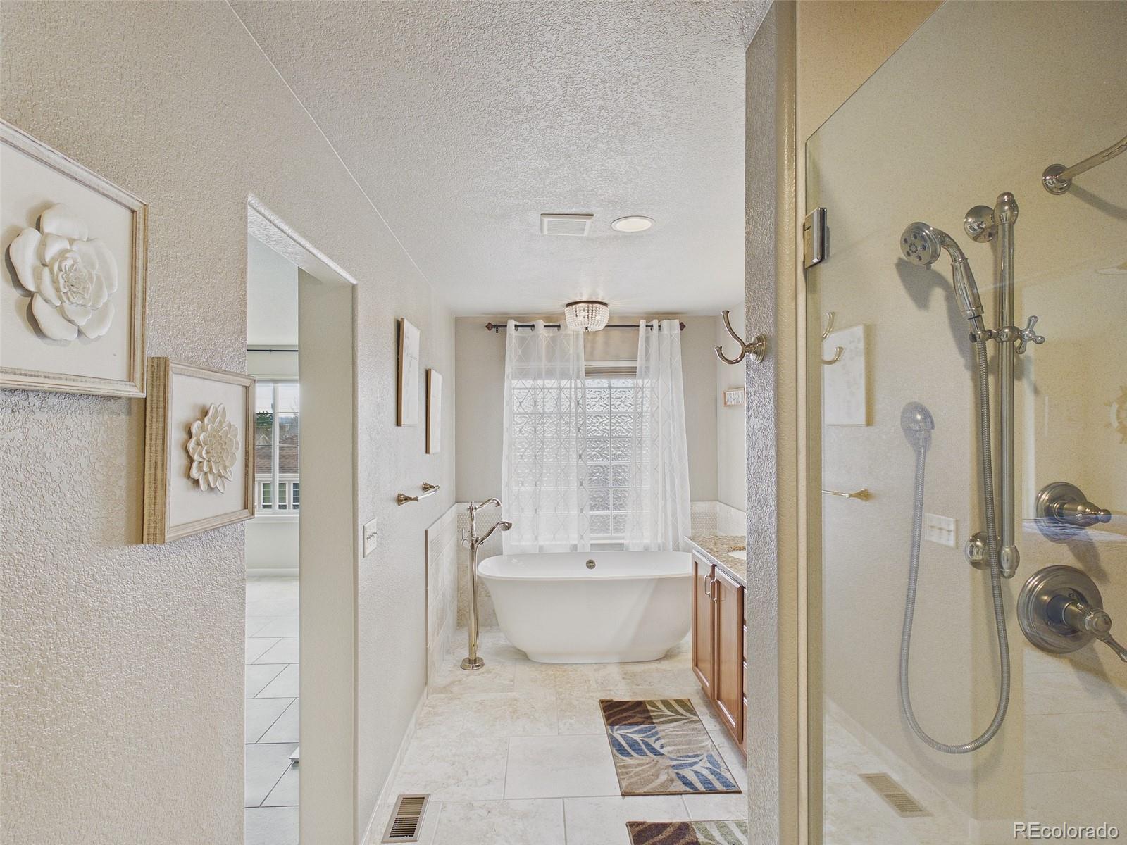 2805 South Jebel Way Aurora, CO 80013 - Photo 32 of 50 a bathroom with a shower toilet and sink