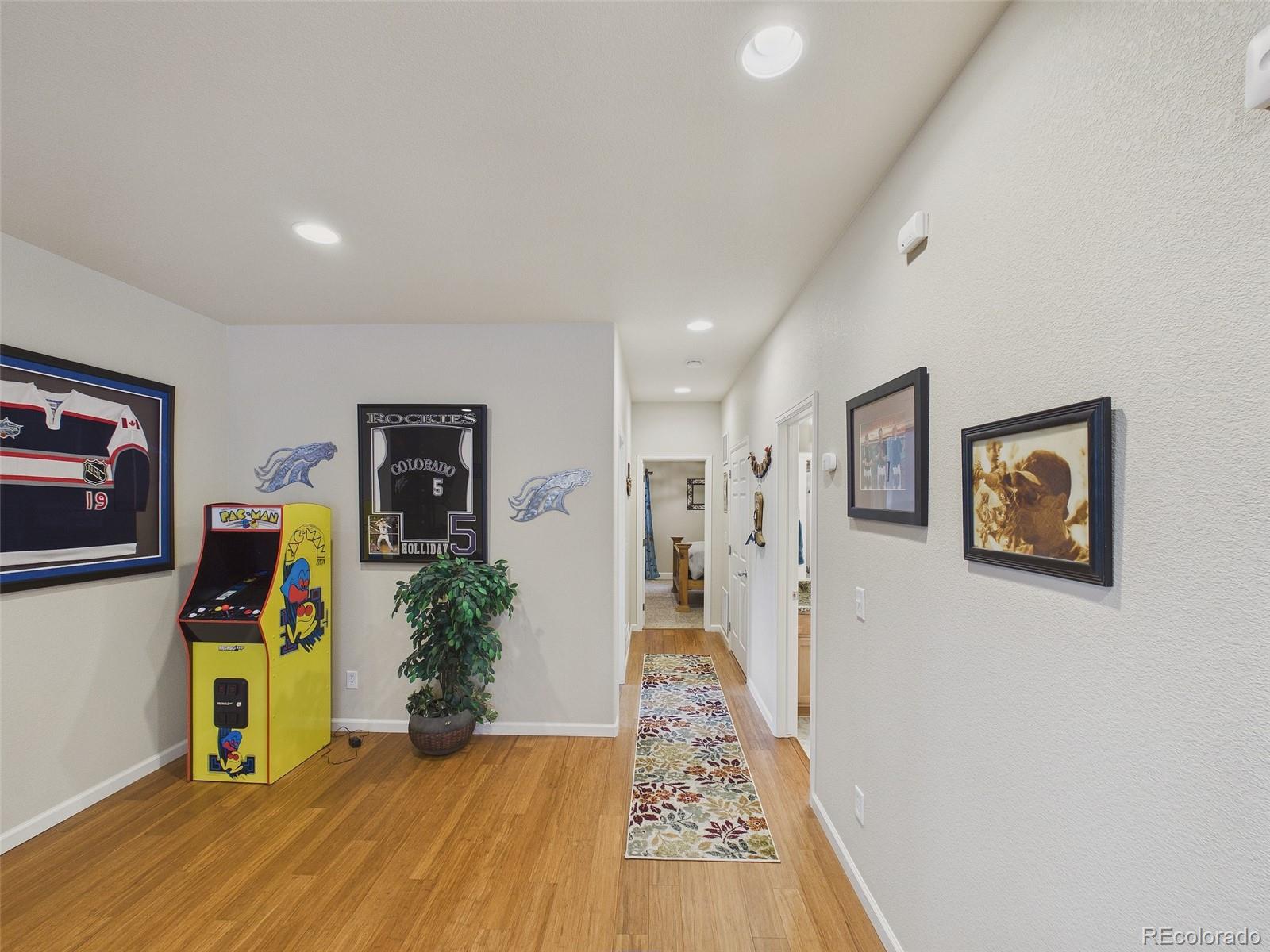 2805 South Jebel Way Aurora, CO 80013 - Photo 39 of 50 a view of a hallway with a workspace