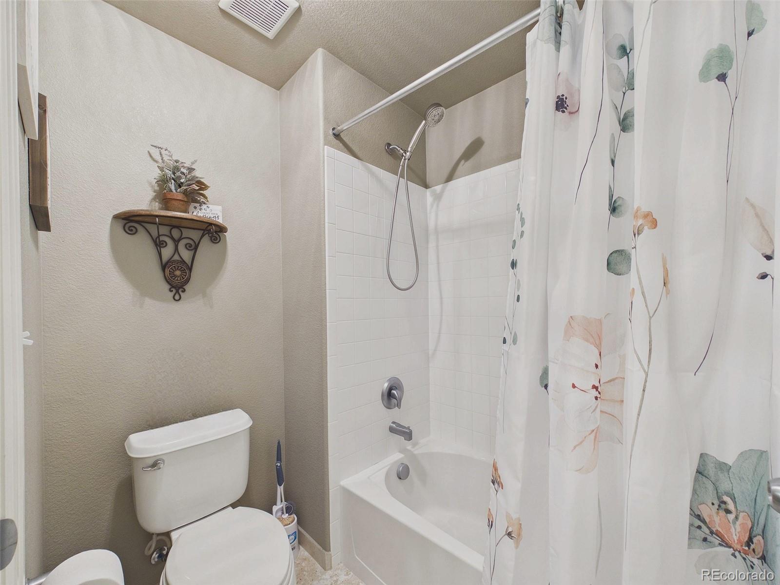 2805 South Jebel Way Aurora, CO 80013 - Photo 41 of 50 a bathroom with a toilet and a shower