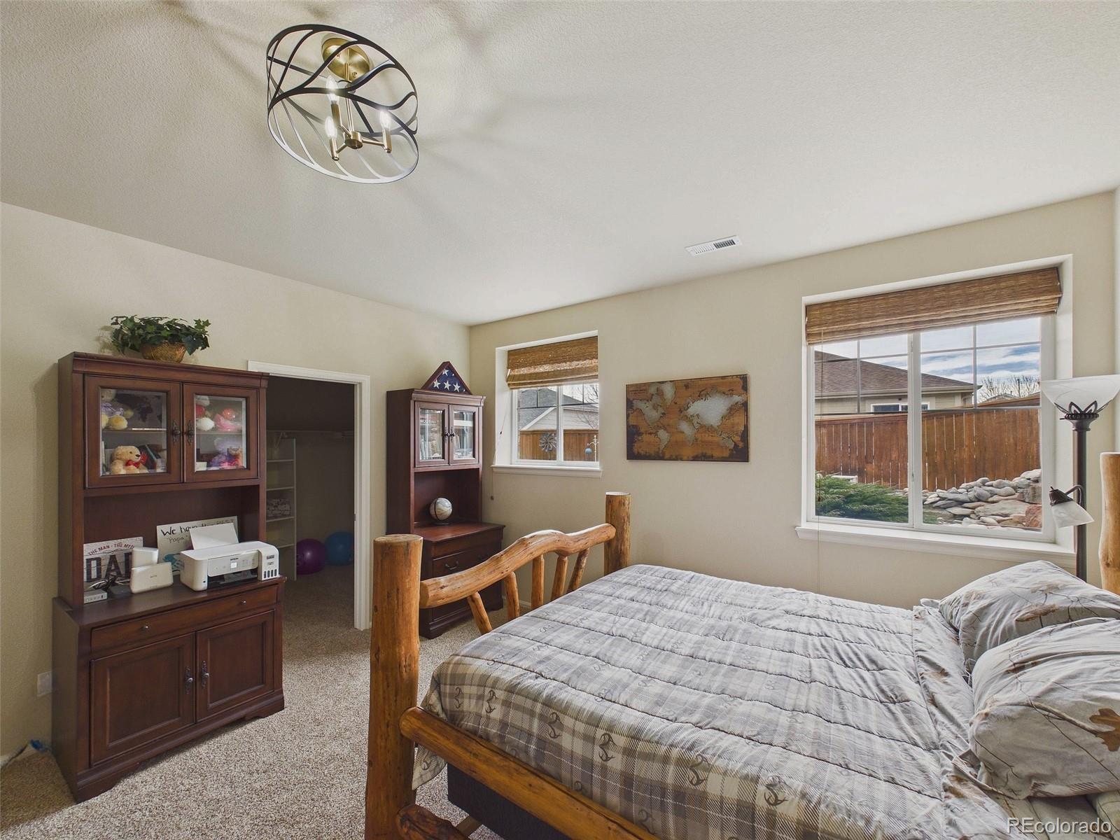 2805 South Jebel Way Aurora, CO 80013 - Photo 43 of 50 a bedroom with a bed and a window