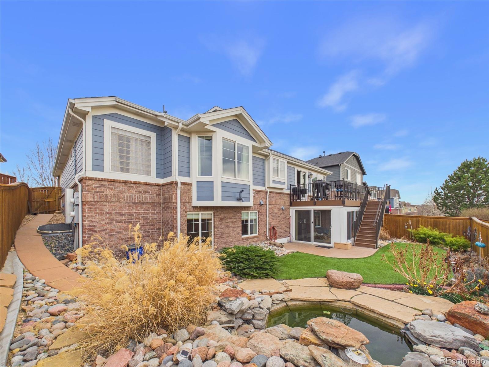 2805 South Jebel Way Aurora, CO 80013 - Photo 48 of 50 a front view of a house with a yard