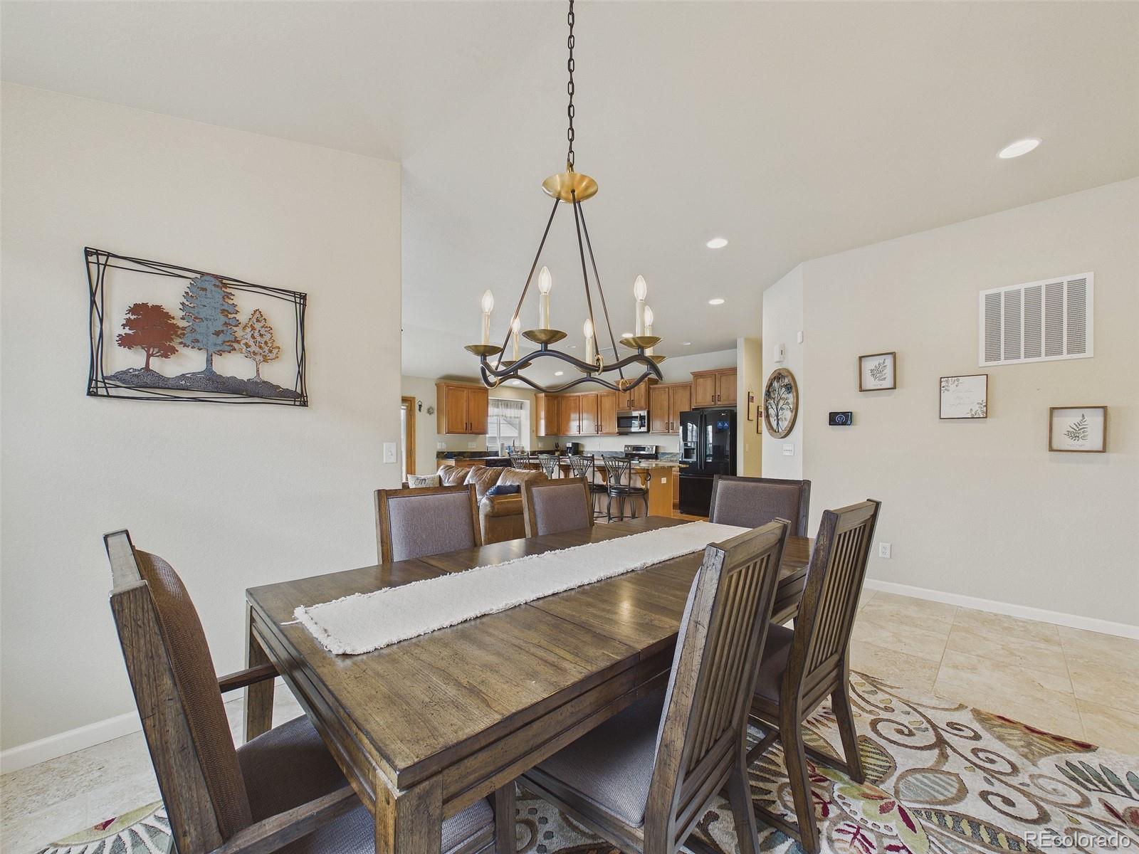 2805 South Jebel Way Aurora, CO 80013 - Photo 8 of 50 a view of a dining room with furniture