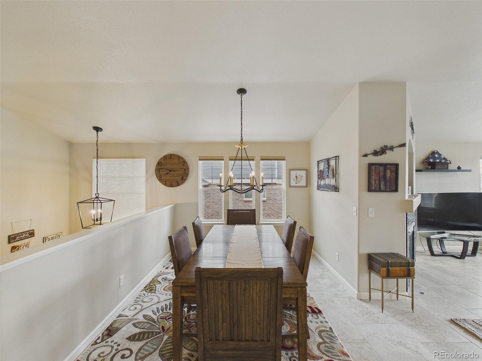 2805 South Jebel Way Aurora, CO 80013 - Photo 10 of 50 a view of a dining room with furniture window and outside view