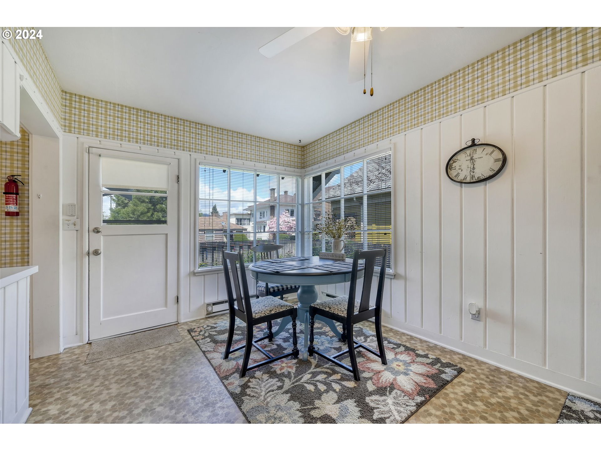 343 5th Street Springfield, OR 97477 - Photo 12 of 28 a view of a dining room and livingroom with furniture wooden floor and a rug