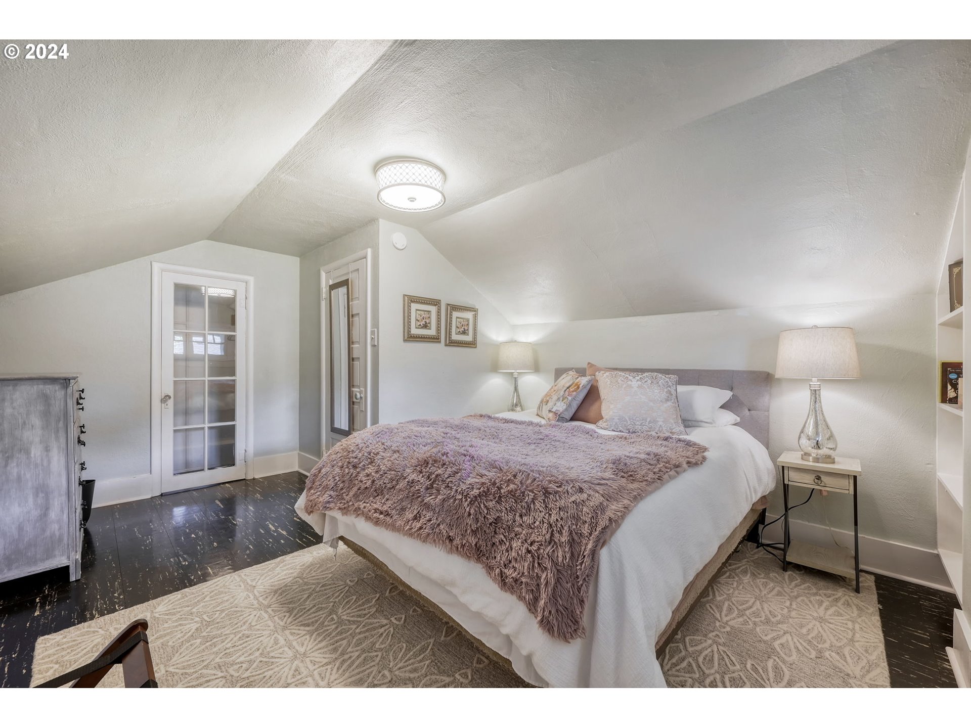 343 5th Street Springfield, OR 97477 - Photo 20 of 28 a bedroom with a bed and wooden floor