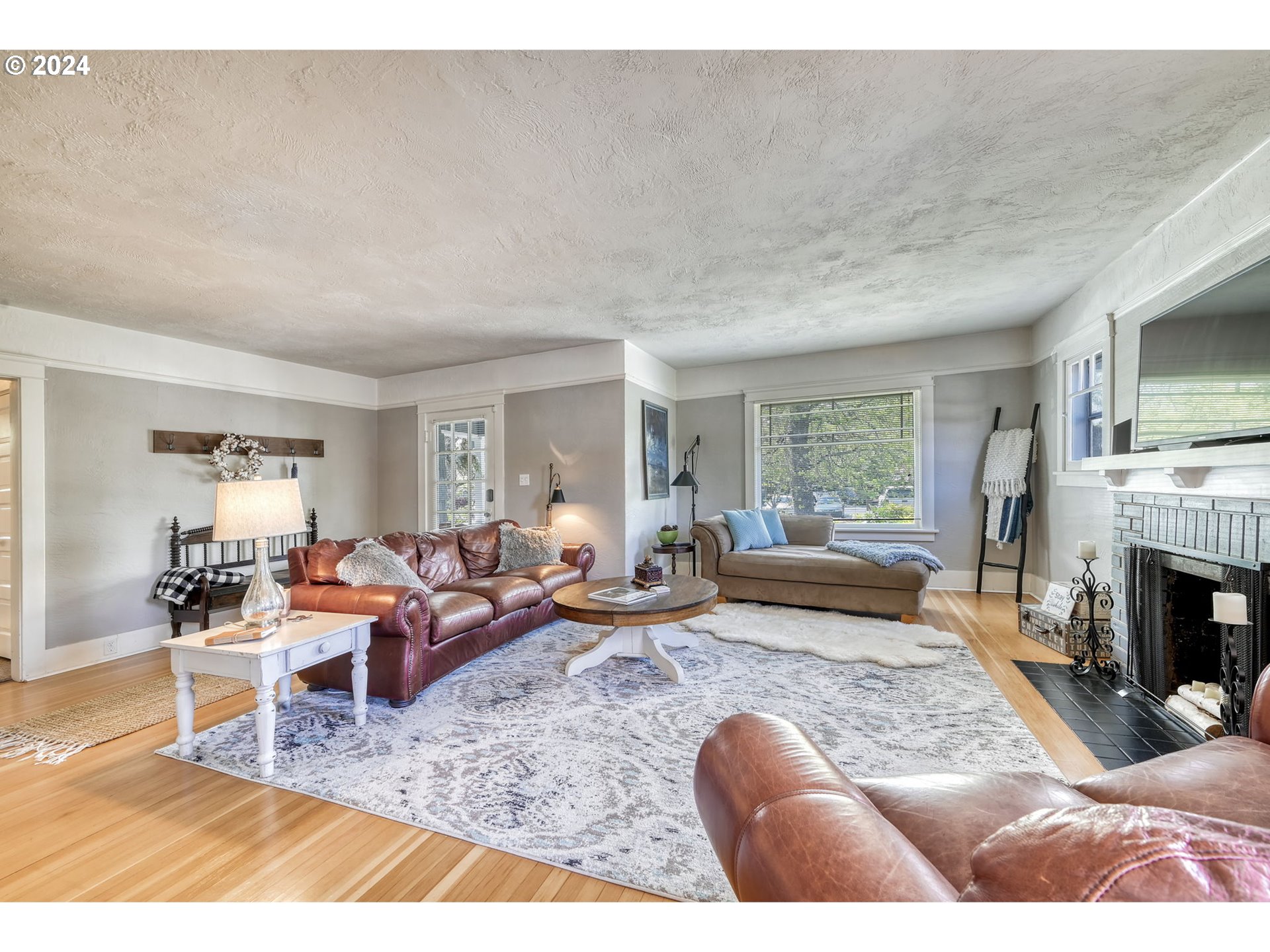 343 5th Street Springfield, OR 97477 - Photo 5 of 28 a living room with furniture or couch and a fireplace