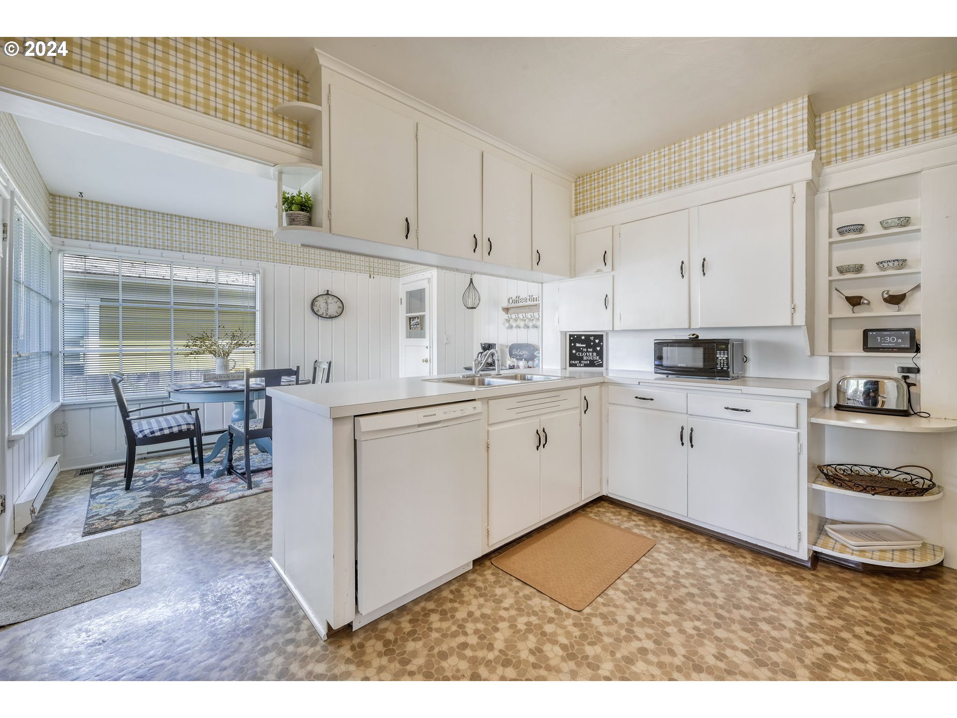 343 5th Street Springfield, OR 97477 - Photo 9 of 28 a kitchen with cabinets and chairs