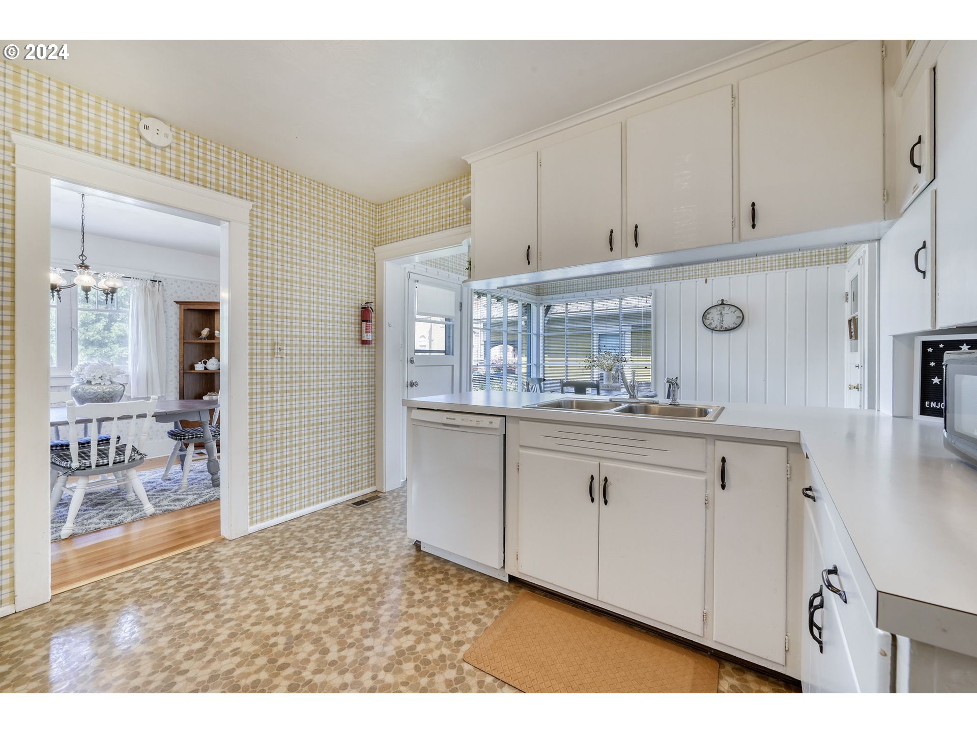 343 5th Street Springfield, OR 97477 - Photo 10 of 28 a kitchen with granite countertop a sink and cabinets