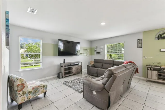 a living room with furniture and a rug