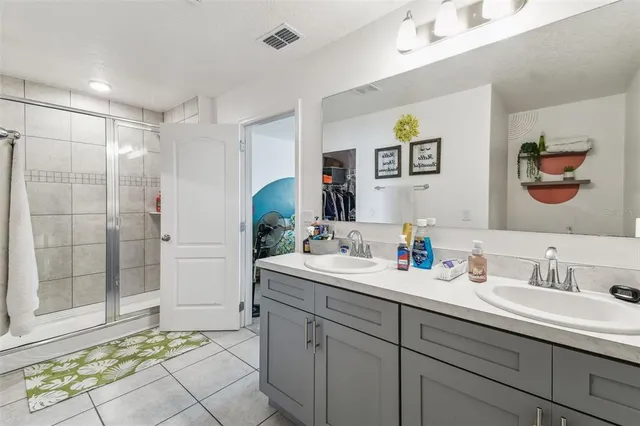 a swimming pool with yard in front of it