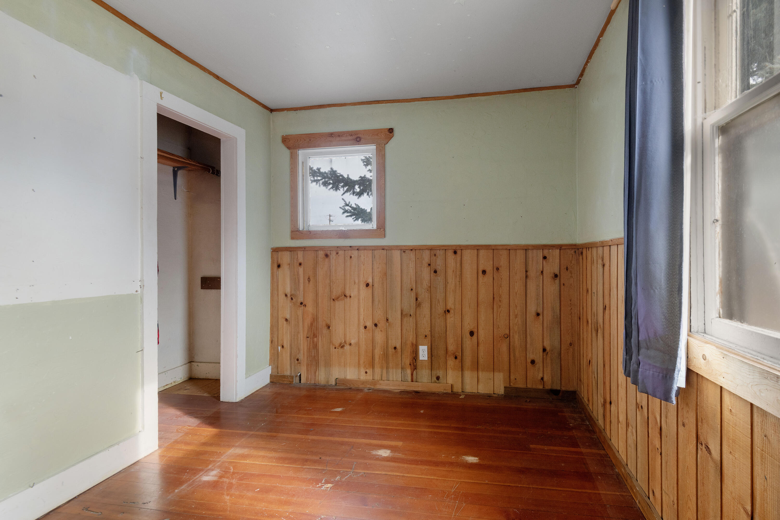 243 West Adams Avenue Sisters, OR 97759 - Photo 10 of 19 a view of an empty room with wooden floor