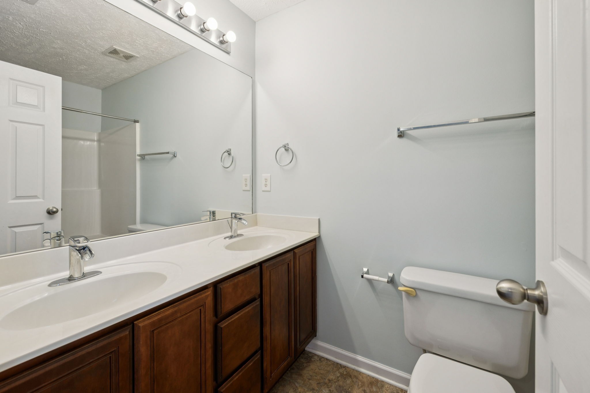 1841 Shaylin Loop Antioch, TN 37013 - Photo 20 of 27 a bathroom with a sink and mirror with toilet