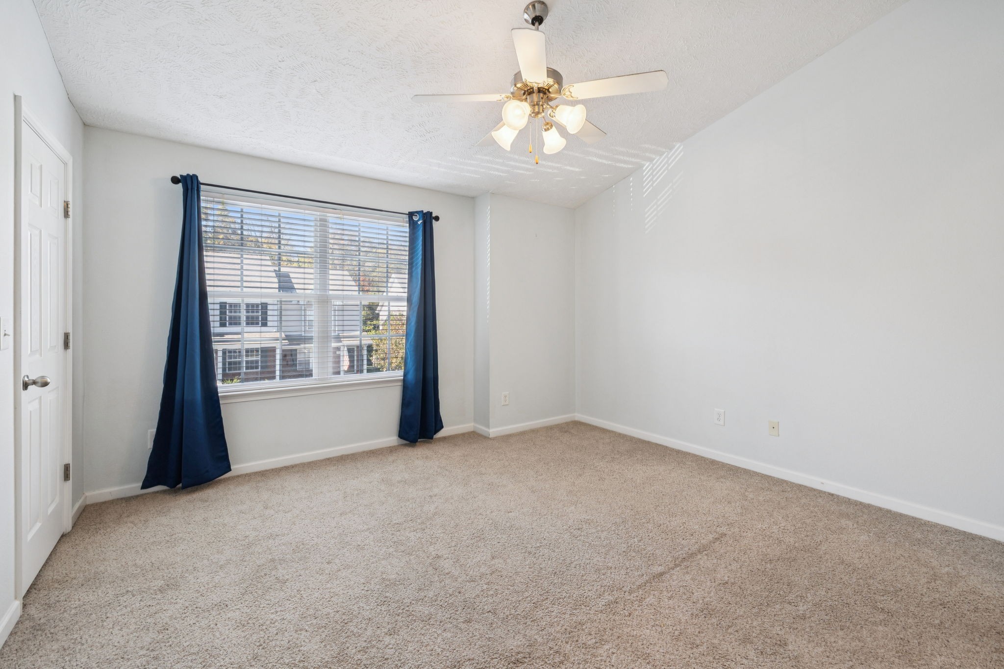 1841 Shaylin Loop Antioch, TN 37013 - Photo 5 of 27 an empty room with chandelier fan and windows