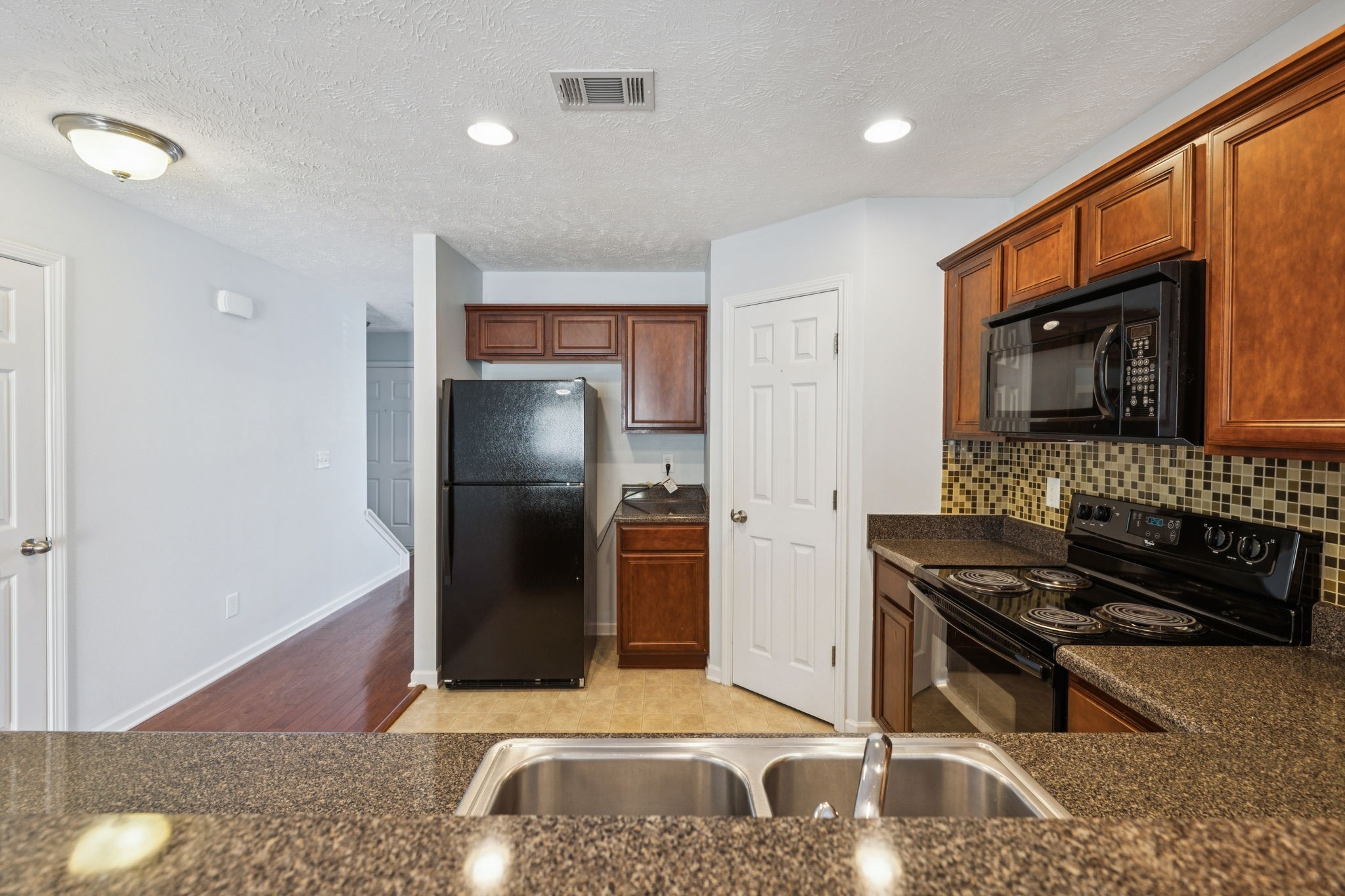 1841 Shaylin Loop Antioch, TN 37013 - Photo 10 of 27 a kitchen with stainless steel appliances granite countertop a refrigerator a stove and a sink