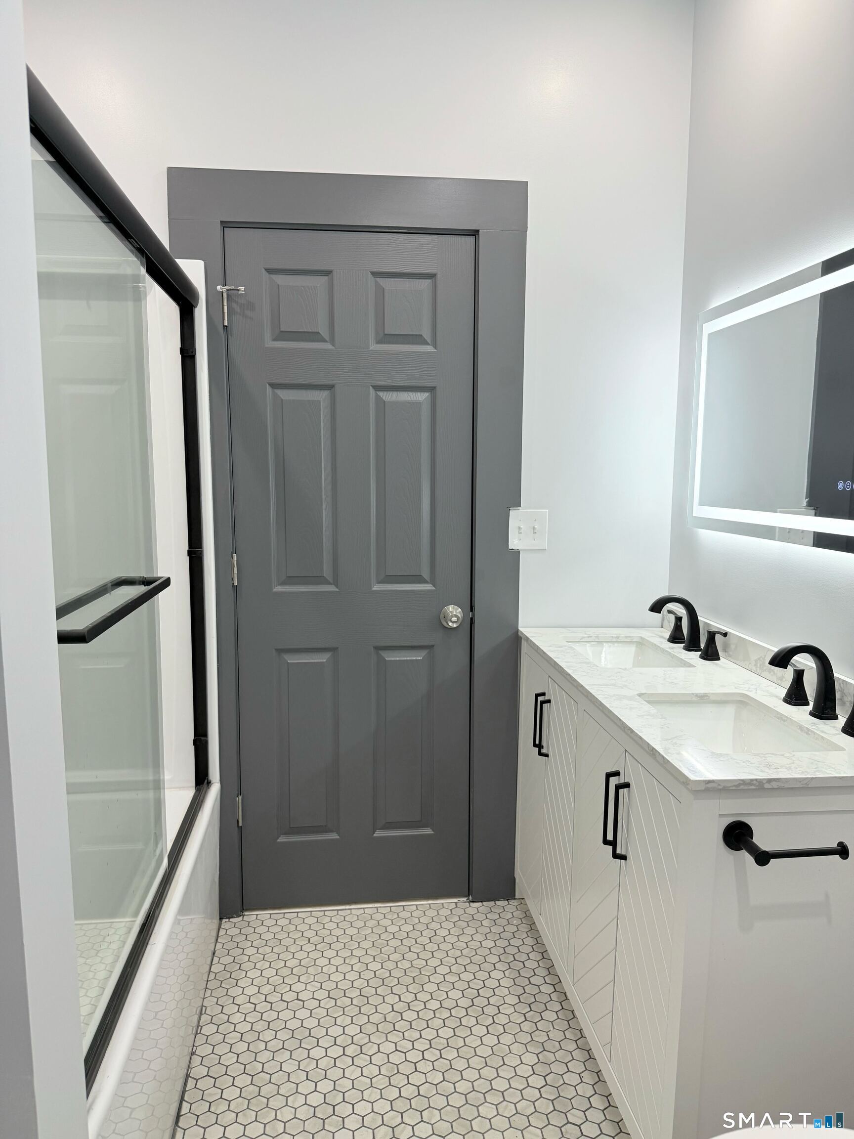 134 Hubinger Street, Unit 2 New Haven, CT 06511 - Photo 13 of 16 a bathroom with a sink a mirror and shower