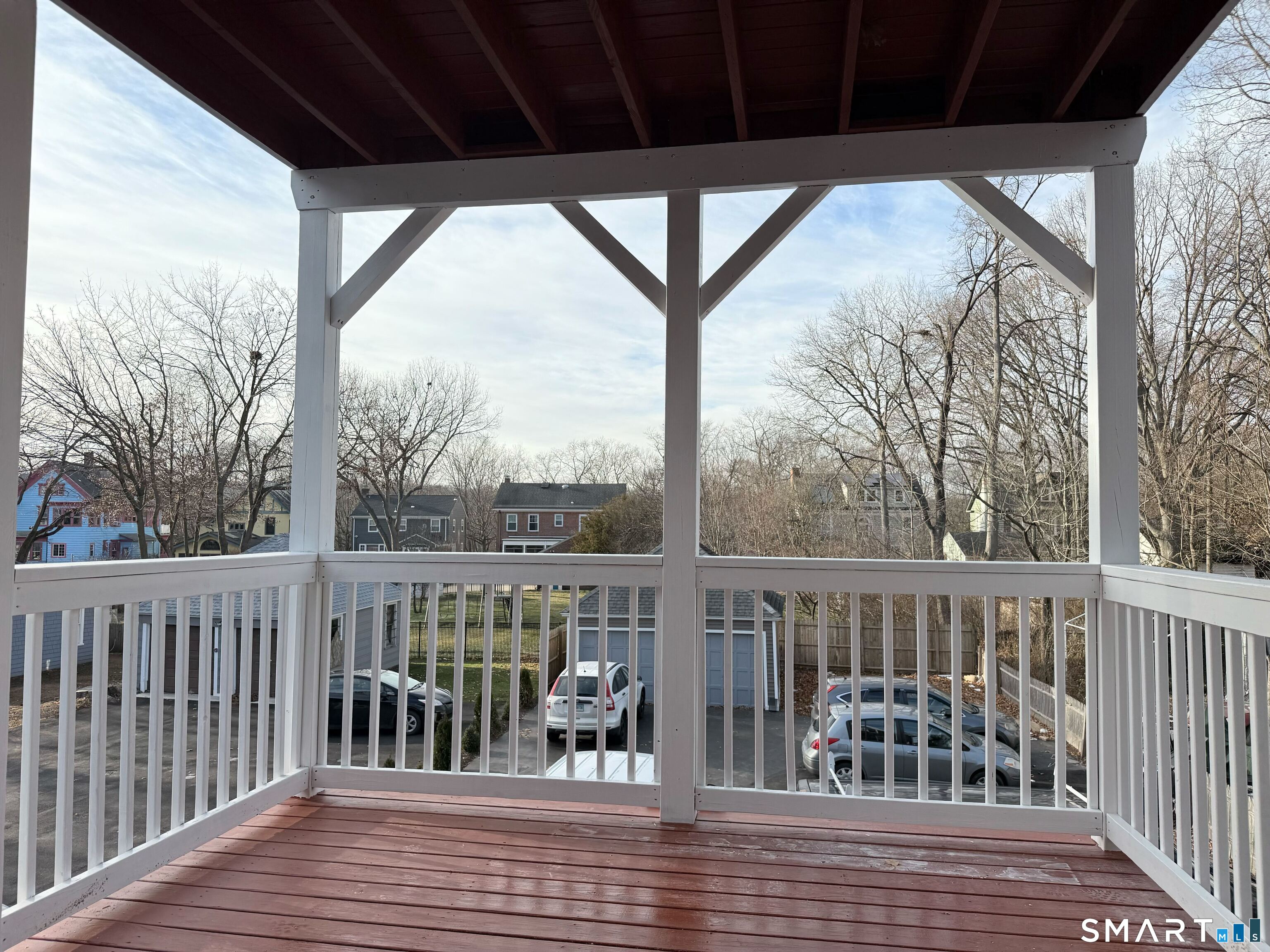 134 Hubinger Street, Unit 2 New Haven, CT 06511 - Photo 15 of 16 a view of roof deck with wooden floor and fence