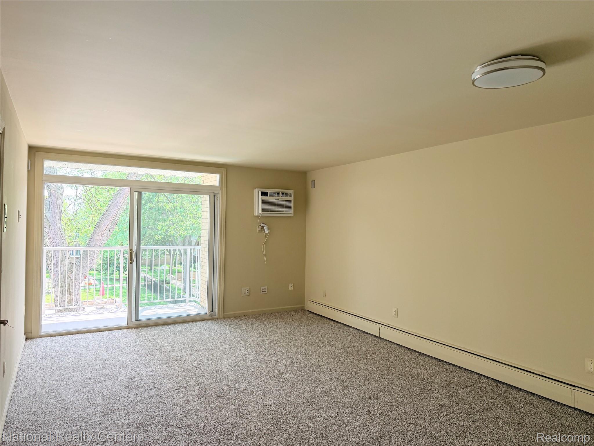 4913 Crooks Road, Unit G4 Royal Oak, MI 48073 - Photo 9 of 19 05_Living Room.JPG