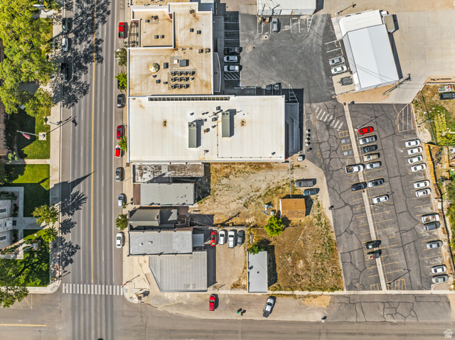 69 South Main Street Manti, UT 84642 - Photo 6 of 44 Aerial view of a commercial area featuring multiple buildings with flat roofs