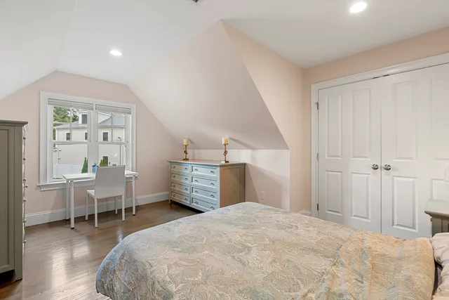 a bedroom with furniture and window