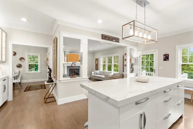 a view of living room with granite countertop furniture and a chandelier