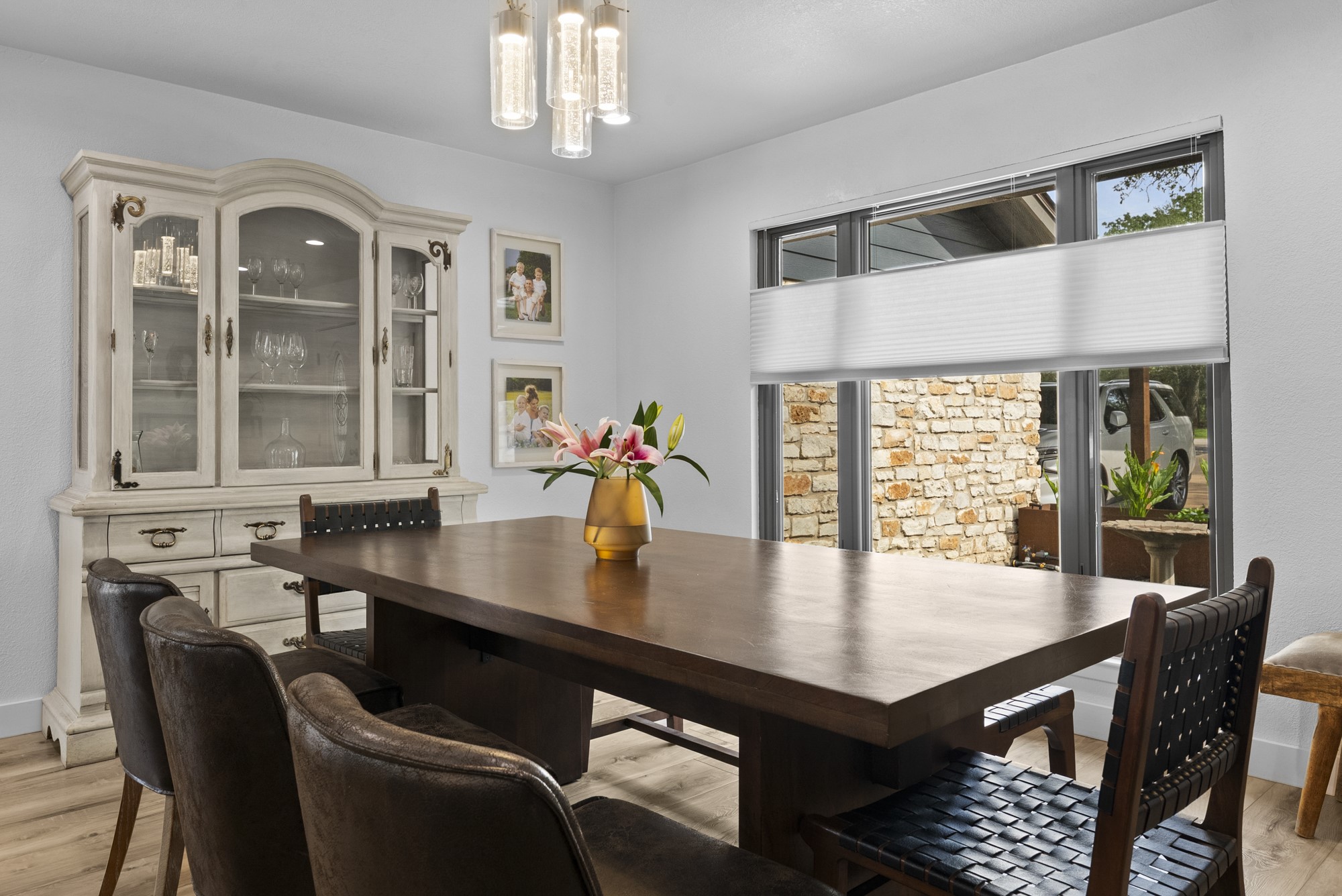 2802 Robin Road Manchaca, TX 78652 - Photo 10 of 40 Dining area featuring wood-finish flooring and a contemporary linear chandelier