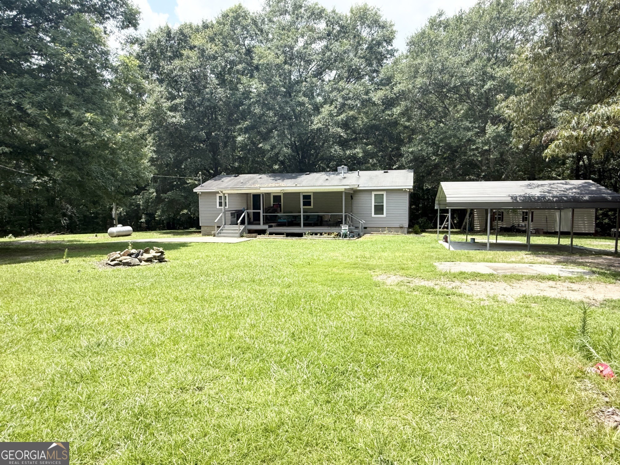 62 Melvin Harris Road Manchester, GA 31816 - Photo 2 of 52 a swimming pool view with a outdoor seating