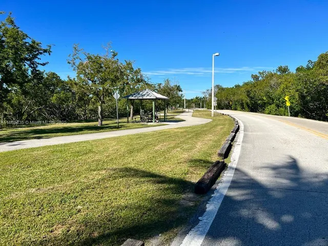 a view of a swimming pool with a yard