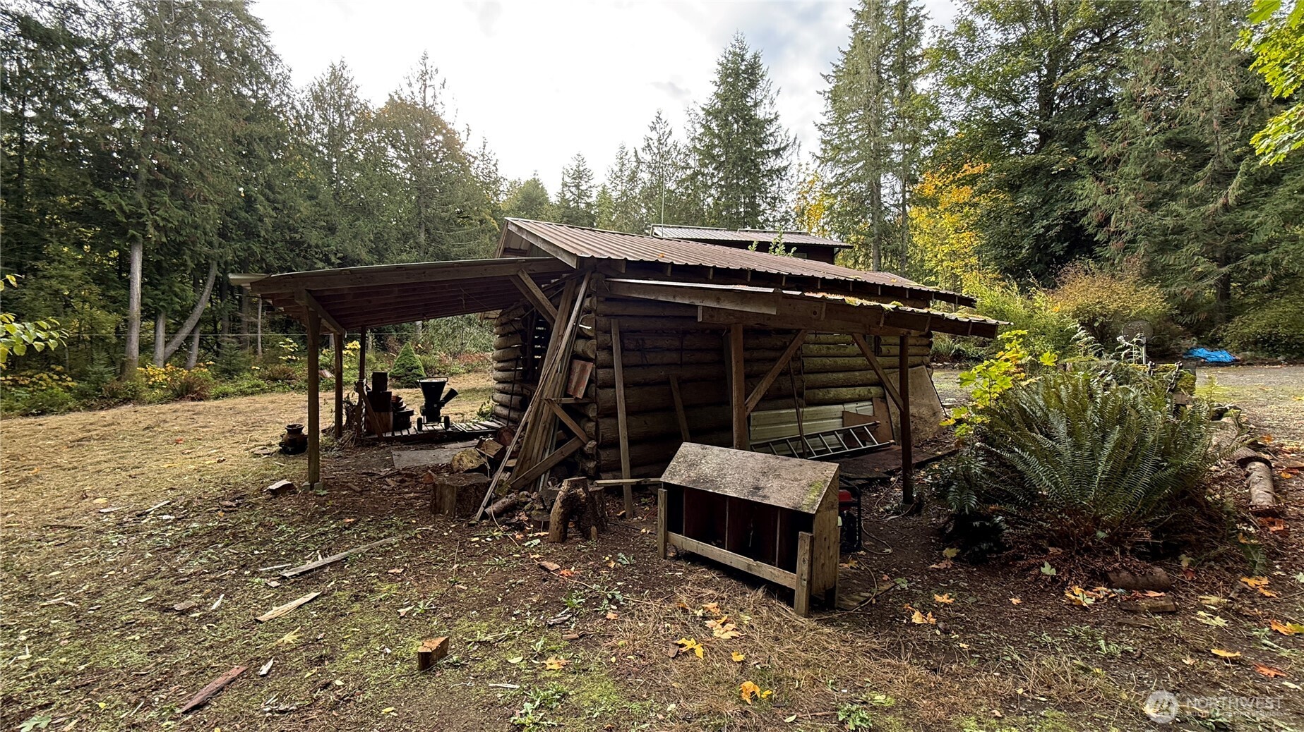 690 Naylor Creek Road Chimacum, WA 98325 - Photo 27 of 40 a view of backyard with deck and outdoor seating