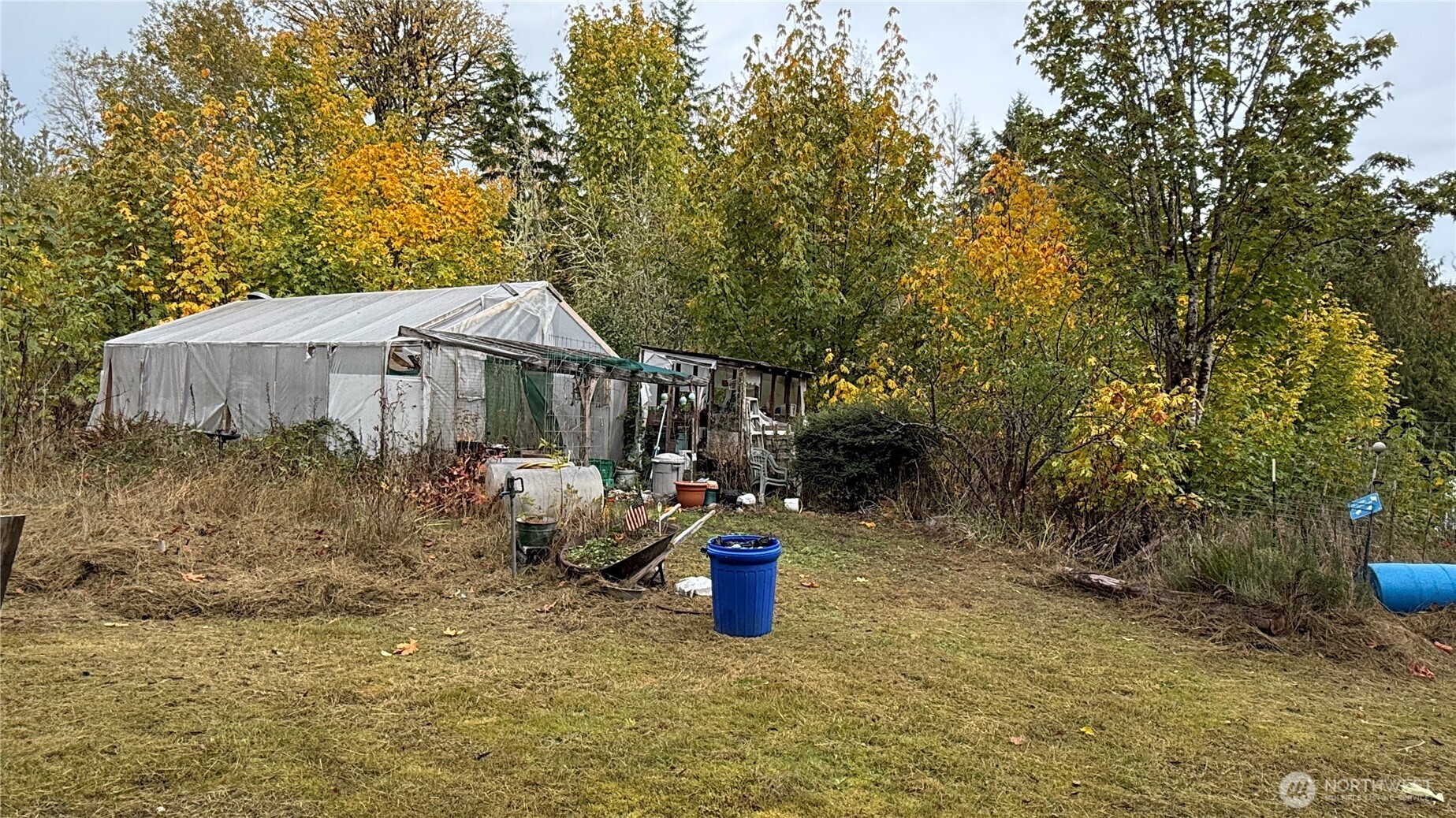 690 Naylor Creek Road Chimacum, WA 98325 - Photo 32 of 40 a view of a house with backyard and sitting area