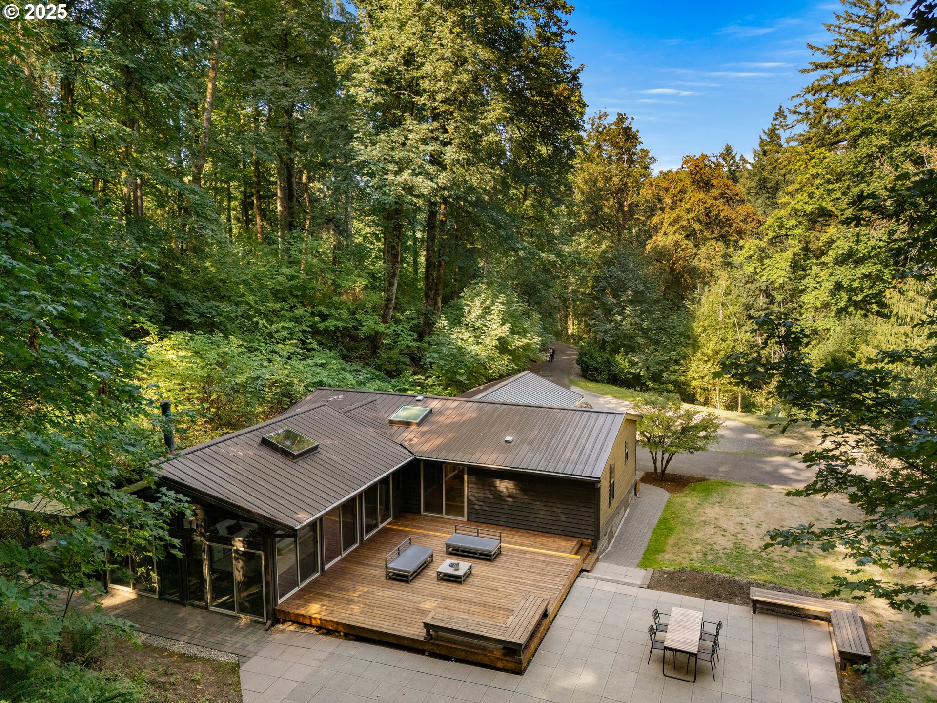 6125 Northwest Thompson Road Portland, OR 97210 - Photo 7 of 39 an aerial view of a house with swimming pool garden view and trees