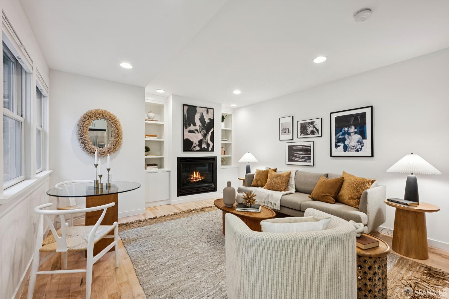 32 Harris Place, Unit A San Francisco, CA 94123 - Photo 2 of 9 a living room with furniture a rug and a fireplace
