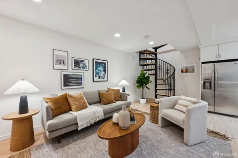 a kitchen with stainless steel appliances a refrigerator sink and microwave