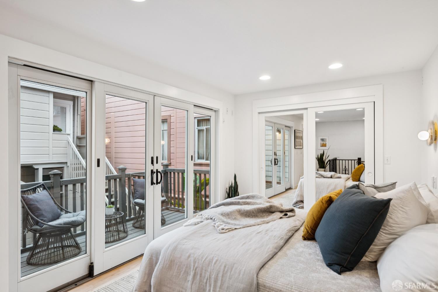 32 Harris Place, Unit A San Francisco, CA 94123 - Photo 6 of 9 a bedroom with a bed and walk in closet