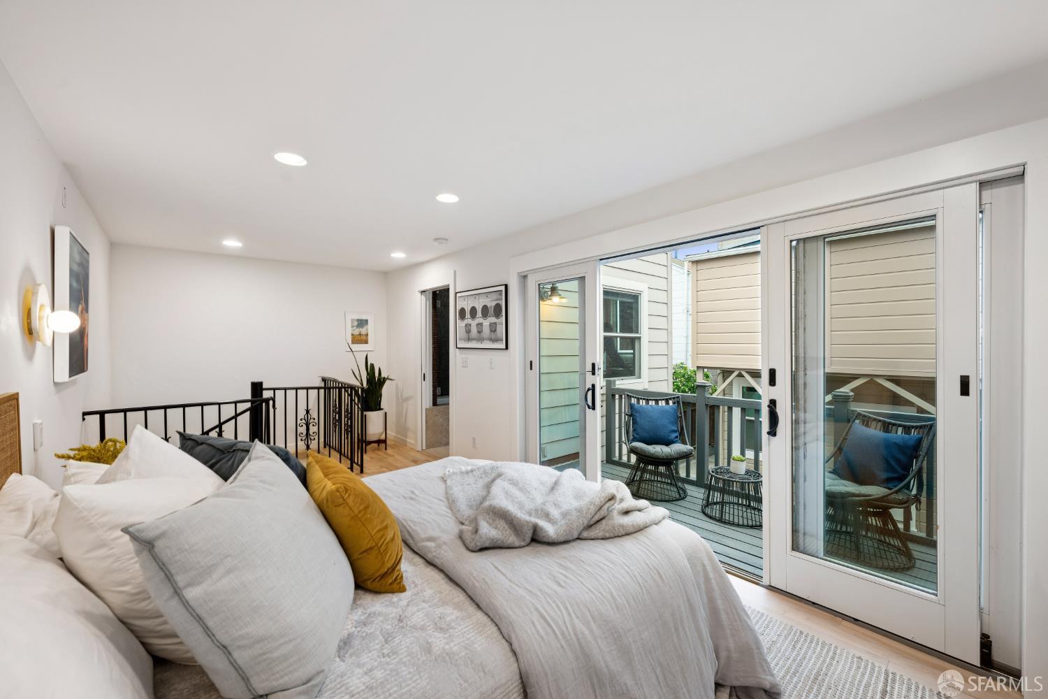 32 Harris Place, Unit A San Francisco, CA 94123 - Photo 7 of 9 a bedroom with a bed and large window