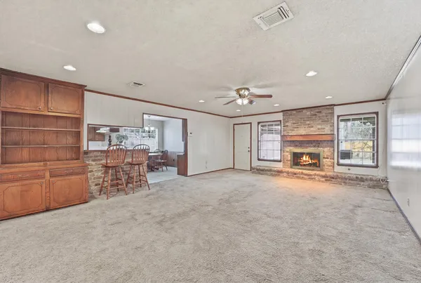 an empty room with furniture and windows