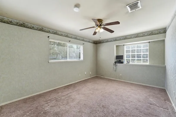 a view of an empty room with a window