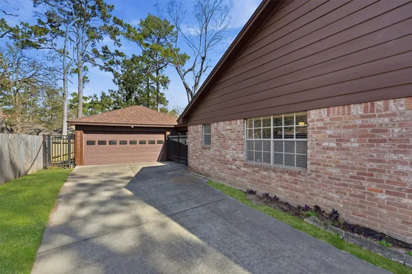 a view of a house with a yard and garage