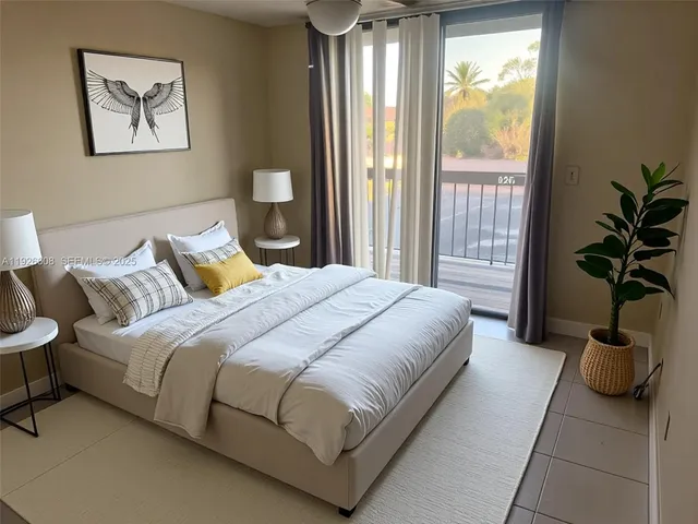 a bedroom with a large bed and a window