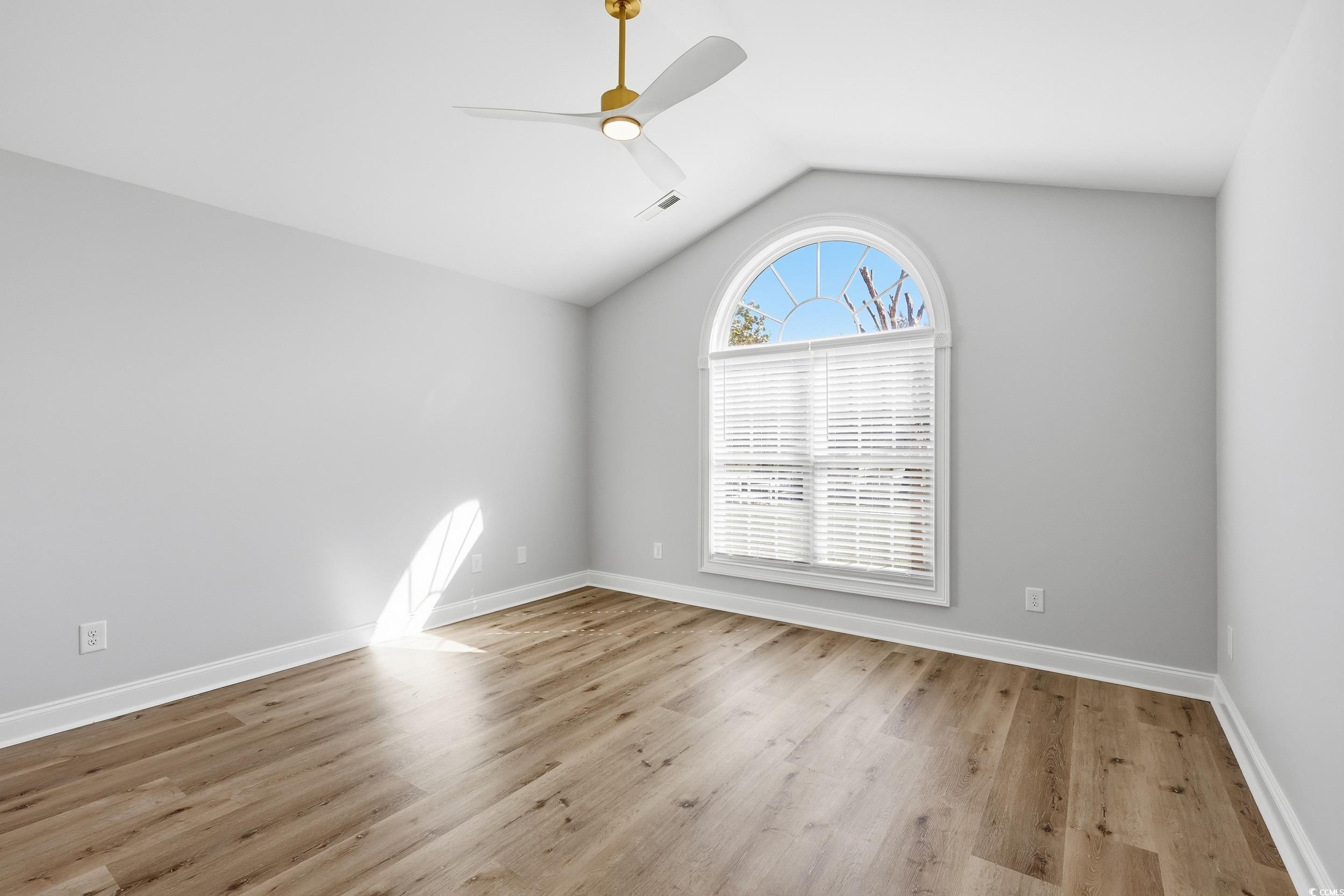 4337 State Highway 65 Conway, SC 29526 - Photo 11 of 39 Spare room with lofted ceiling, light wood finished floors, and a ceiling fan