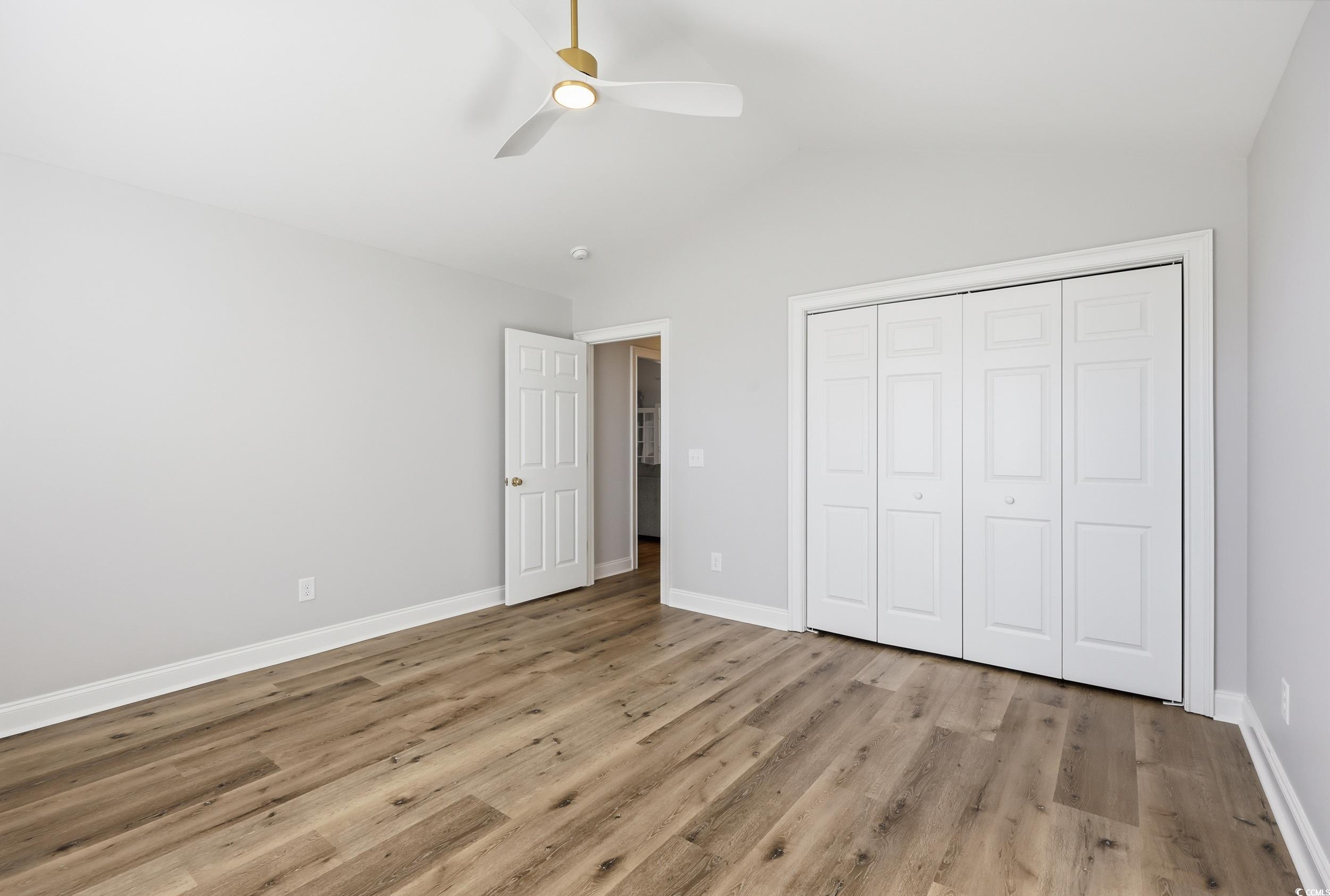 4337 State Highway 65 Conway, SC 29526 - Photo 12 of 39 Unfurnished bedroom featuring lofted ceiling, light wood finished floors, a ceiling fan, and a closet