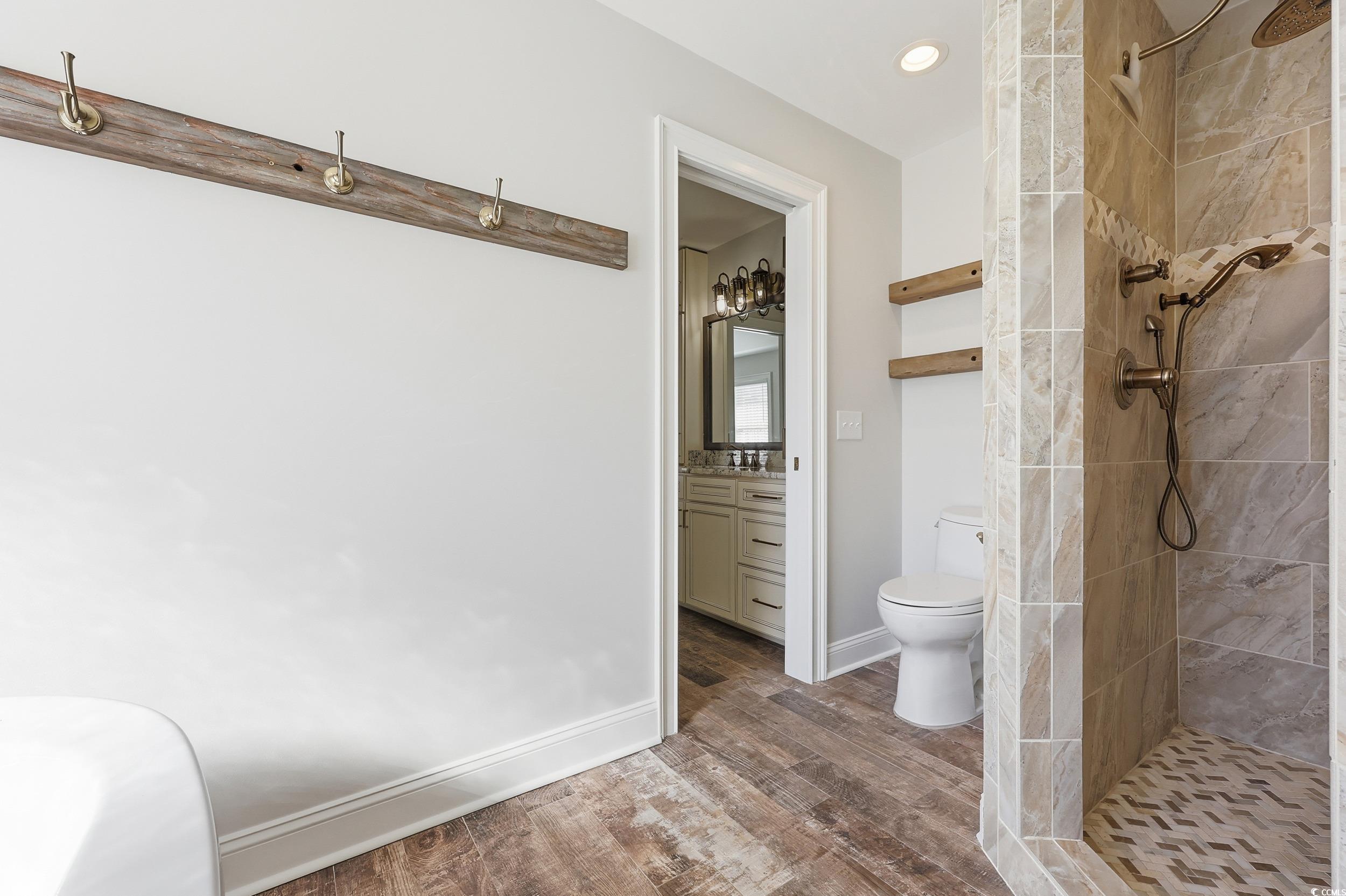 4337 State Highway 65 Conway, SC 29526 - Photo 19 of 39 Full bath featuring a tile shower, vanity, dark wood-style flooring, and recessed lighting