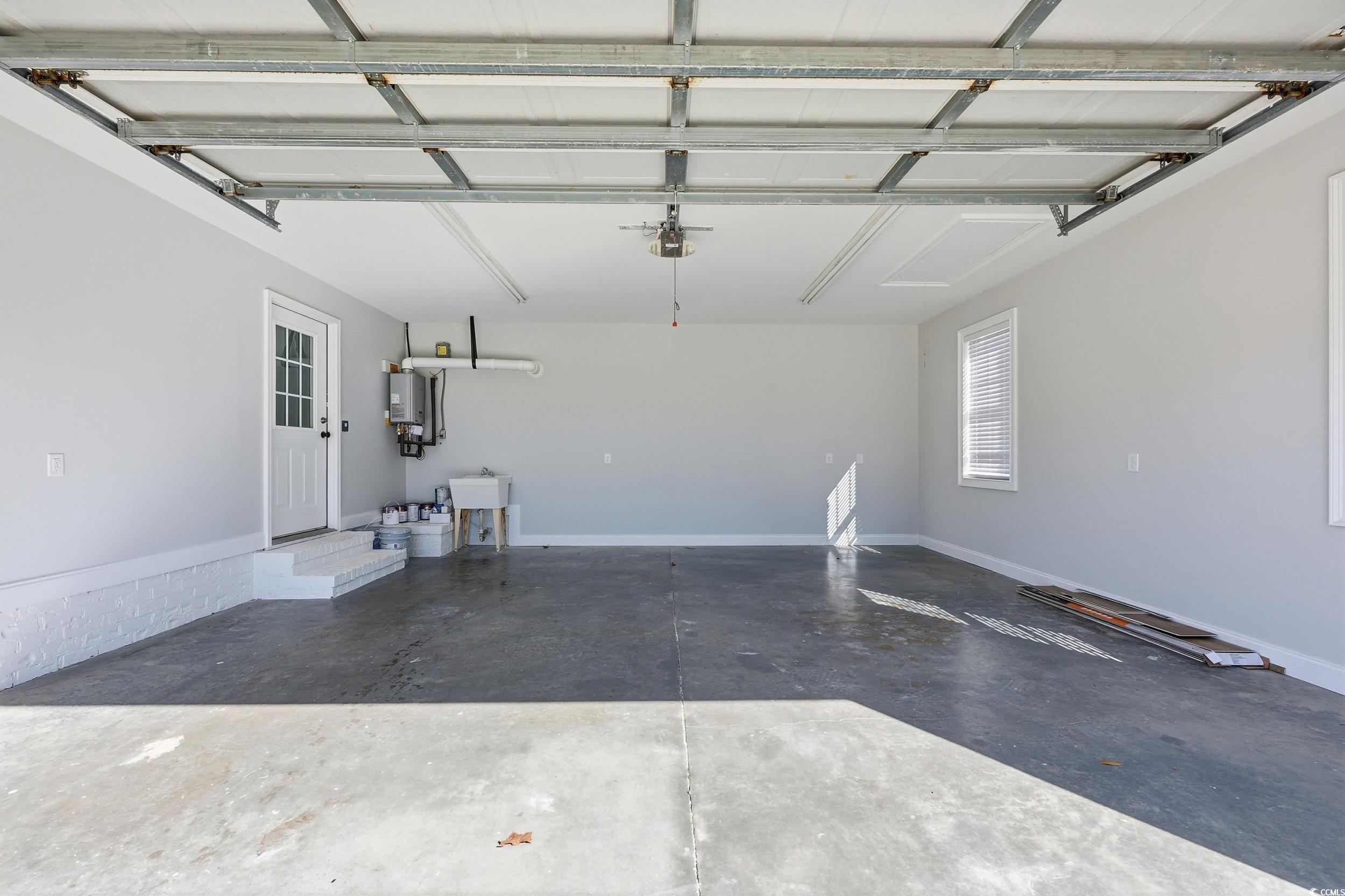 4337 State Highway 65 Conway, SC 29526 - Photo 22 of 39 Garage featuring water heater