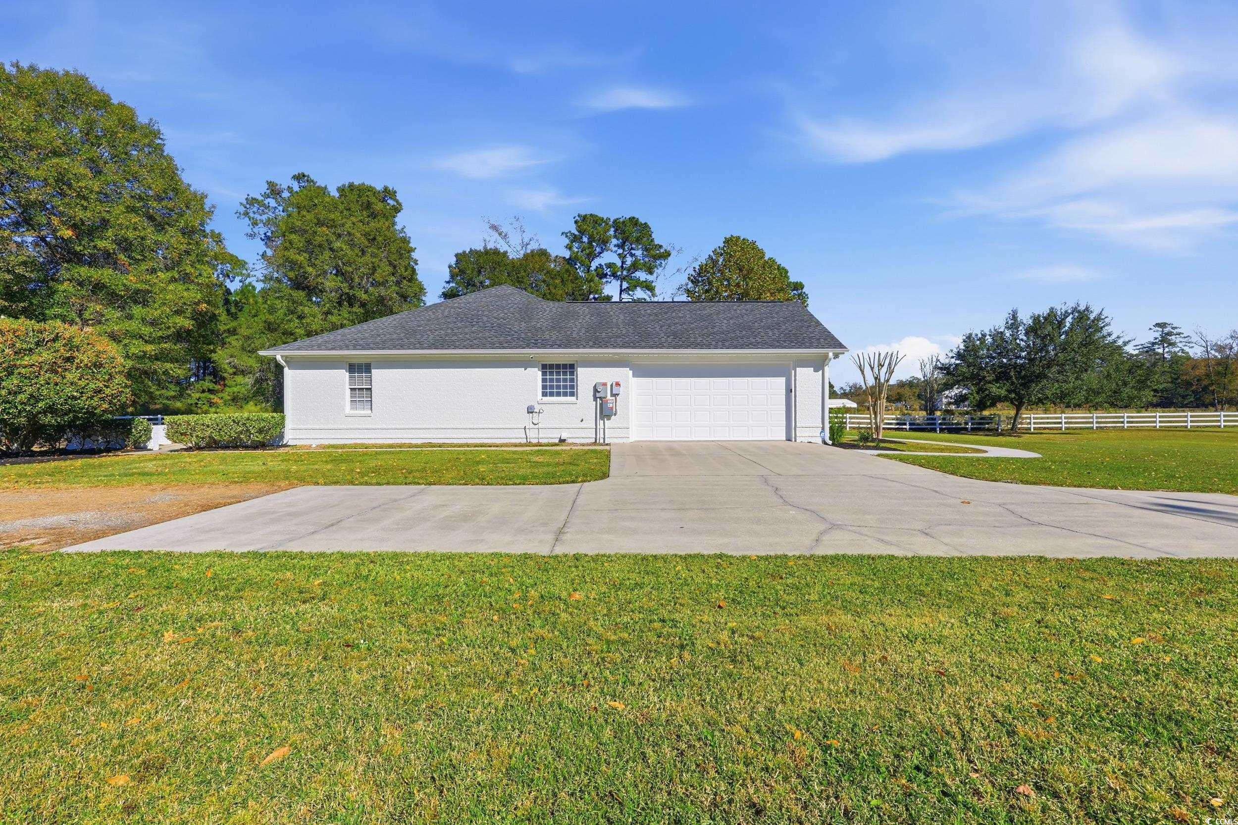 4337 State Highway 65 Conway, SC 29526 - Photo 25 of 39 View of side of property featuring a garage and driveway