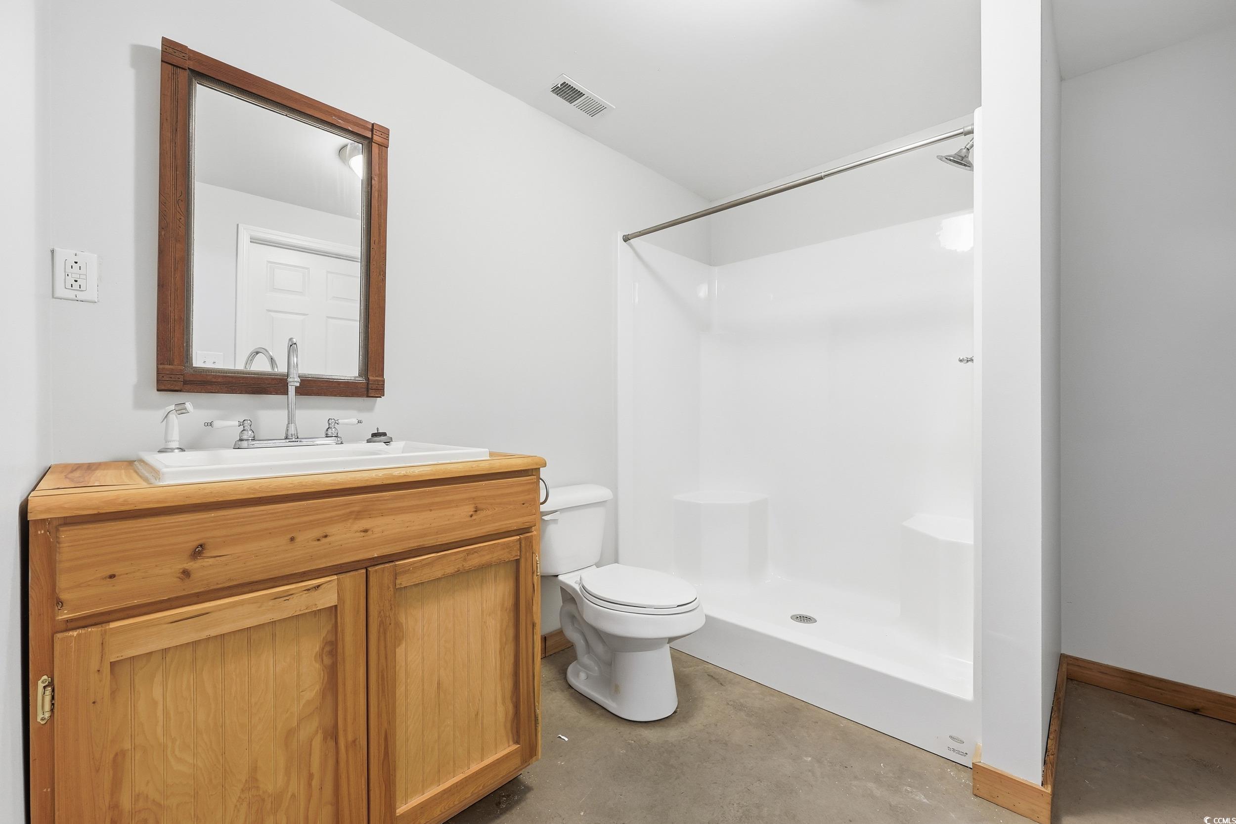4337 State Highway 65 Conway, SC 29526 - Photo 29 of 39 Full bath with vanity, a shower stall, and concrete flooring